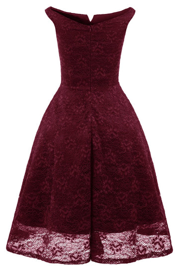 Um vestido de cocktail verde escuro bateau line